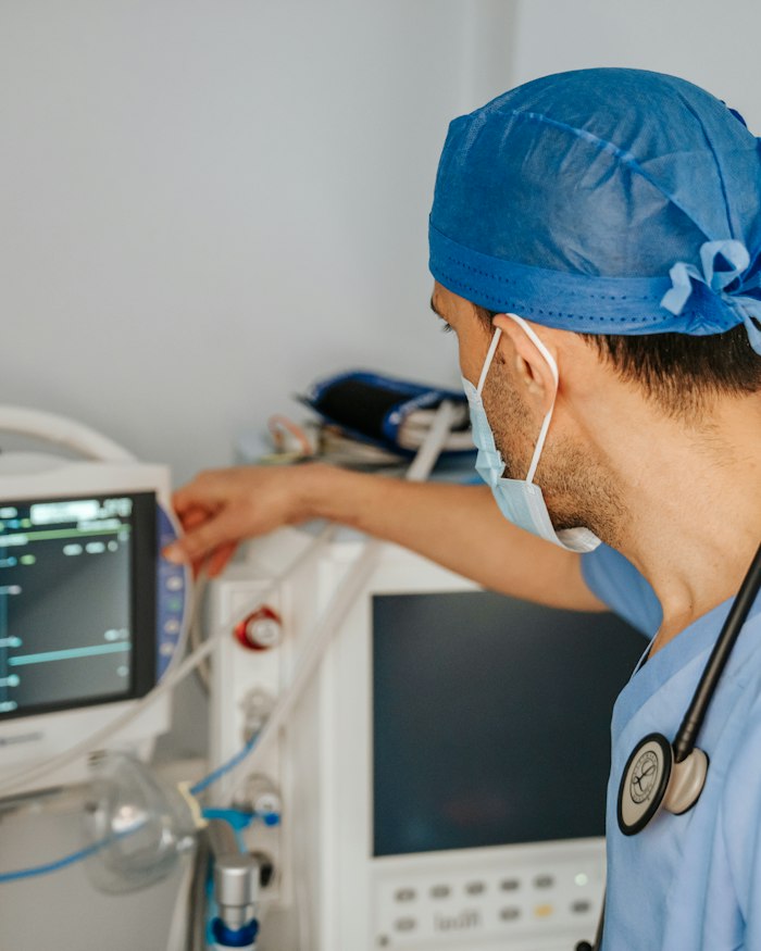 Clinician reviewing a patient chart at a workstation
